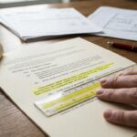 Subcontractor reviewing a pay when paid clause in a subcontract before signing.